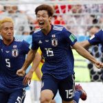C) celebrates with teammates after scoring a goal during the Russia 2018 World Cup Group H football match between Colombia and Japan at the Mordovia Arena in Saransk on June 19, 2018.