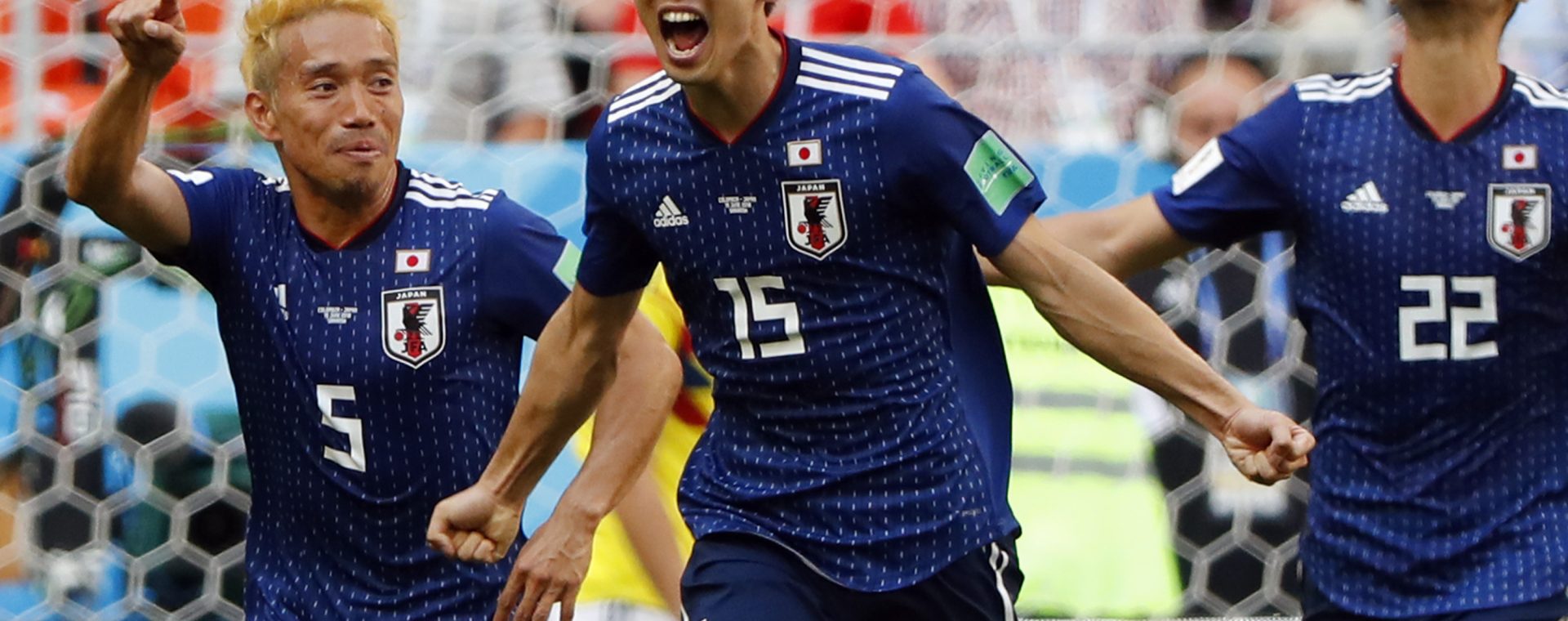 C) celebrates with teammates after scoring a goal during the Russia 2018 World Cup Group H football match between Colombia and Japan at the Mordovia Arena in Saransk on June 19, 2018.