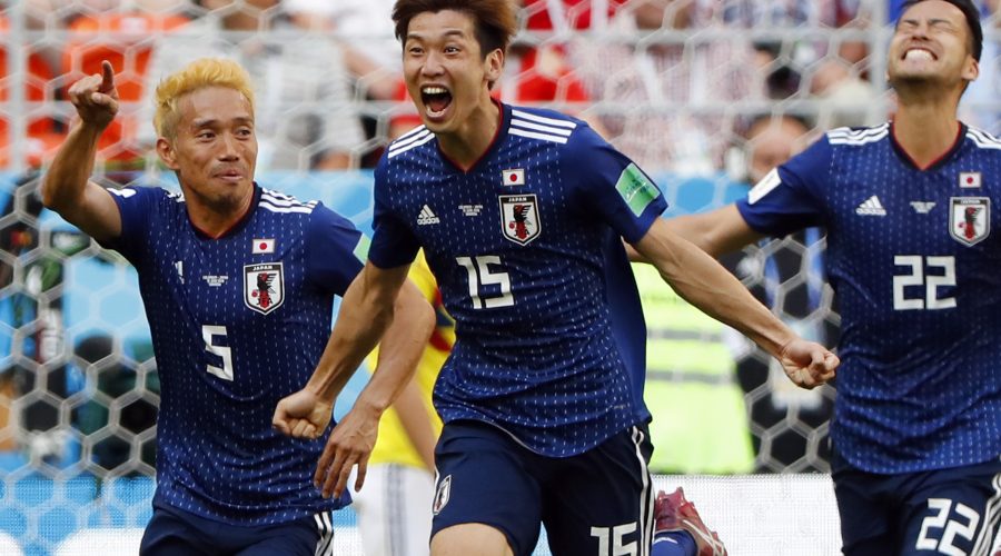 C) celebrates with teammates after scoring a goal during the Russia 2018 World Cup Group H football match between Colombia and Japan at the Mordovia Arena in Saransk on June 19, 2018.
